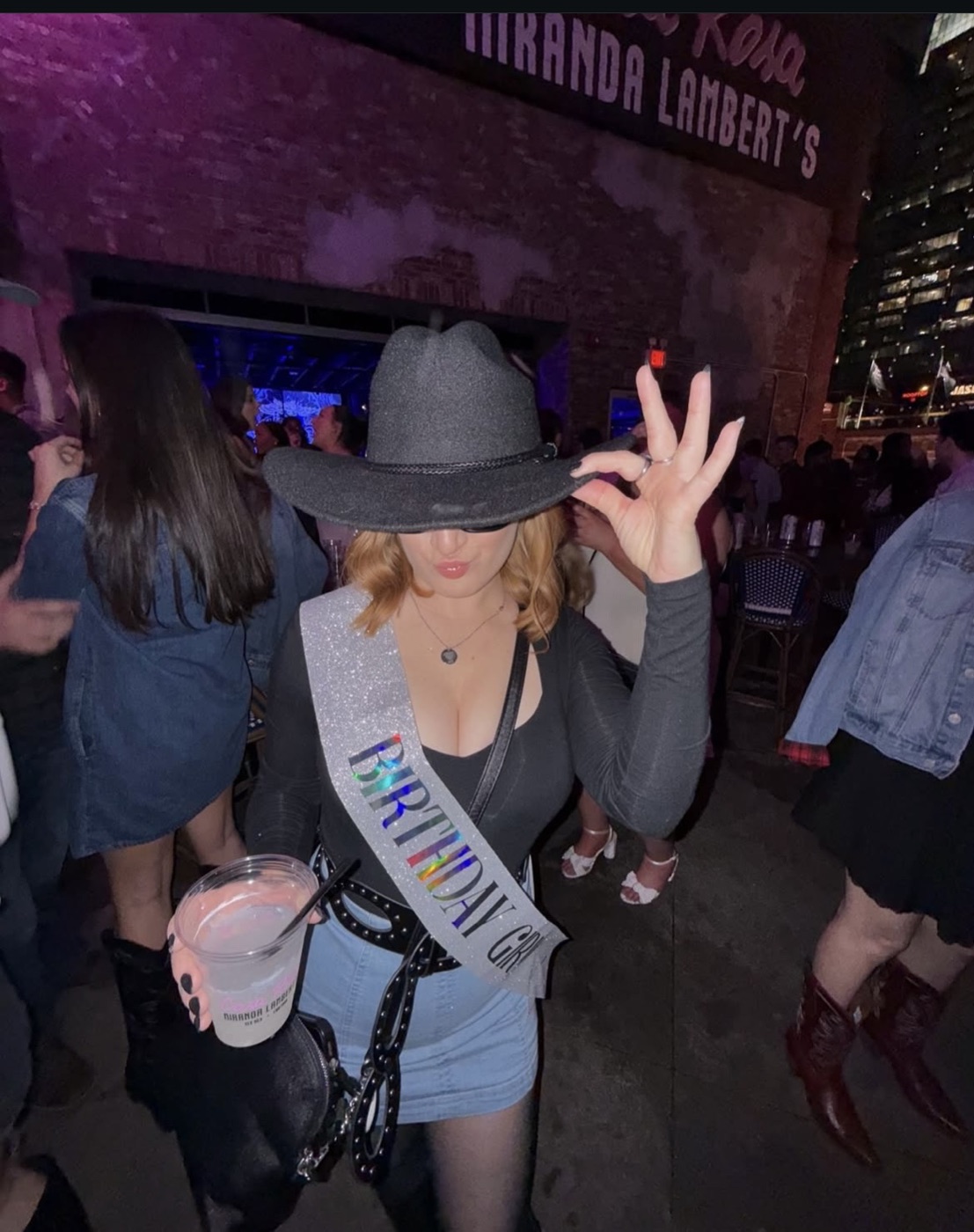Birthday Betties wearing a cowboy hat, sash and boots